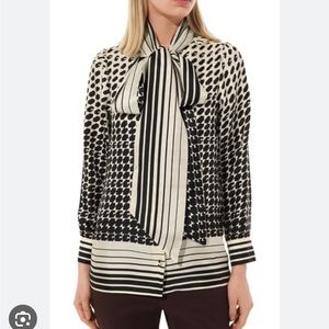 Brand new Gucci patterned silk blouse. Never worn with tags. Size 38.